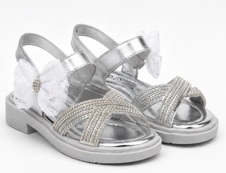 Silver girls’ sandals with sparkling diamanté crossover straps, oversized glitter mesh bow detail 