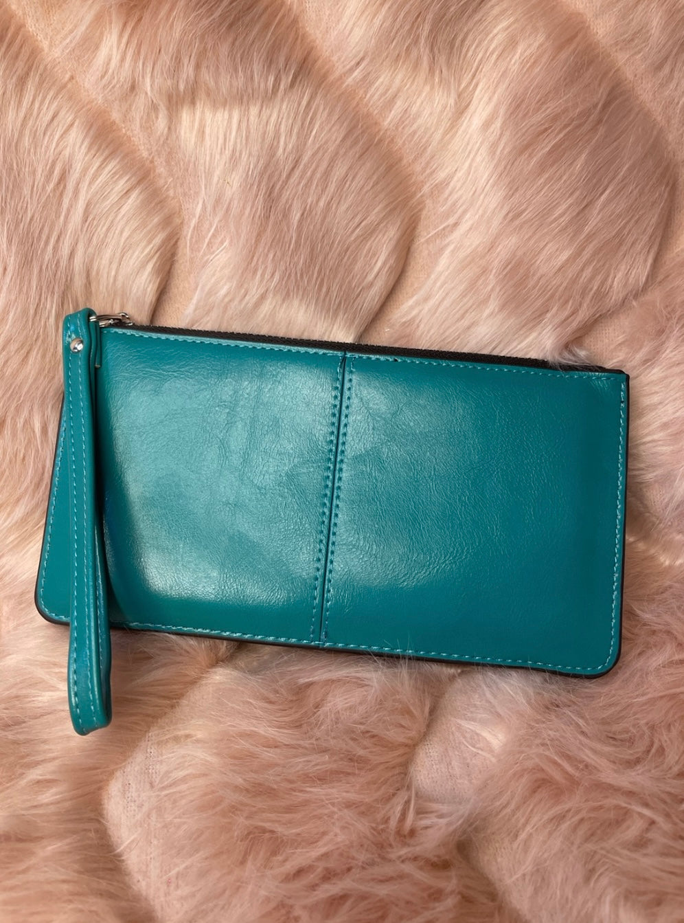 A teal blue expandable silver detail purse 
