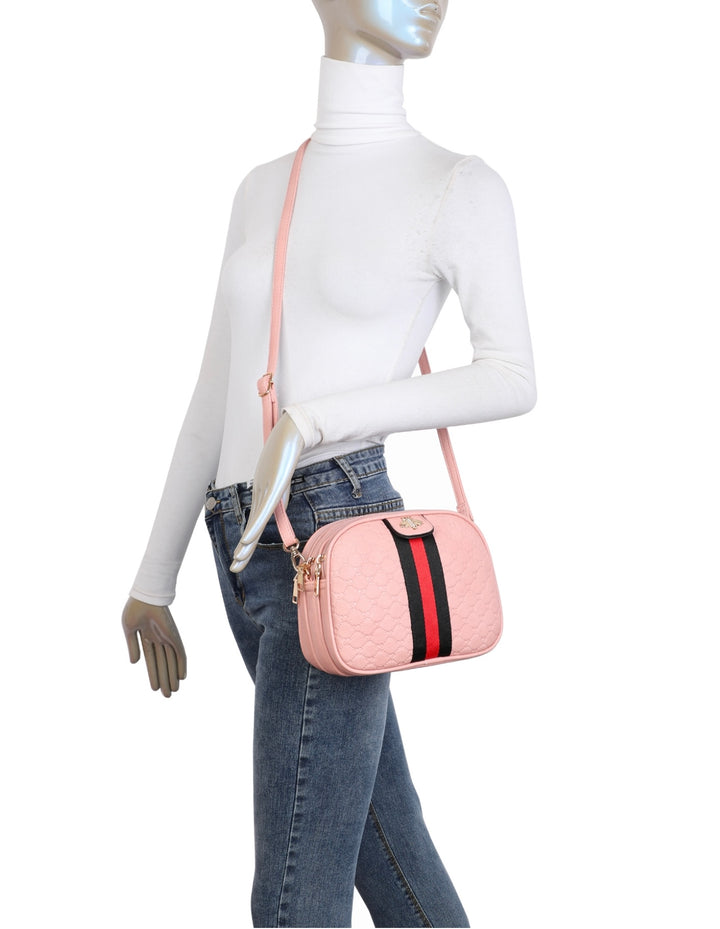 A pink quilted bee design cross body bag with a detachable and adjustable strap, featuring golden tone metal hardware.