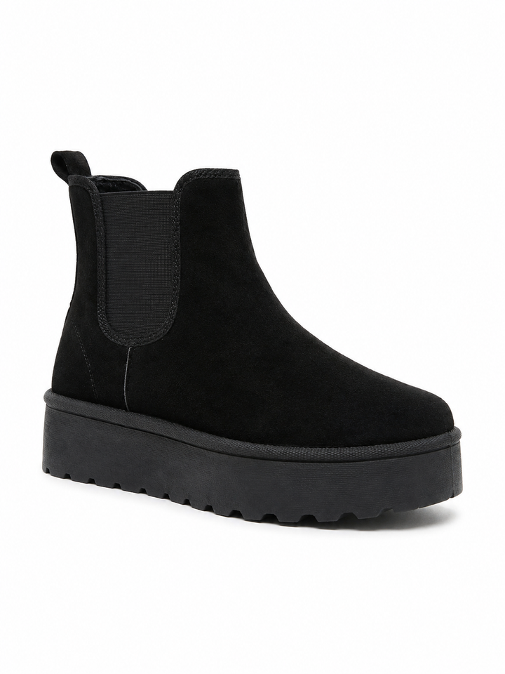 Black suede chunky platform Chelsea ankle boots with elastic side panels and thick ridged sole