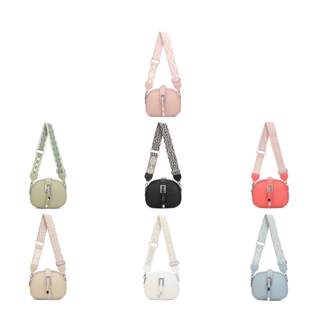 Crossbody bag with patterned strap and multiple zip compartments in various colours
