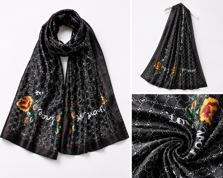 Black satin feel scarf with monogram inspired print, floral detailing and contrasting border