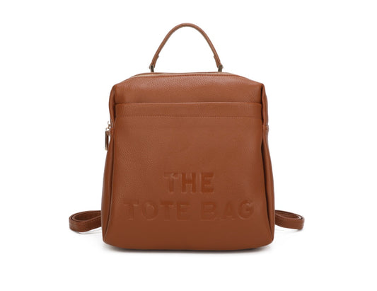 Brown rucksack with embossed “ the tote bag” writing on the front 