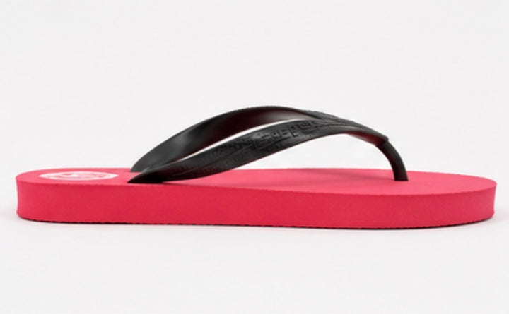 Red flip flops with black straps and lightweight foam sole