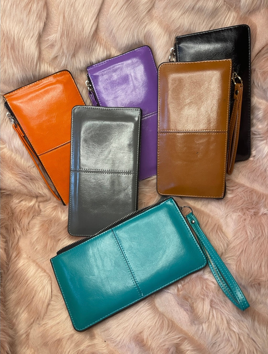 A collection of expandable purses in various colours with silver detailing 
