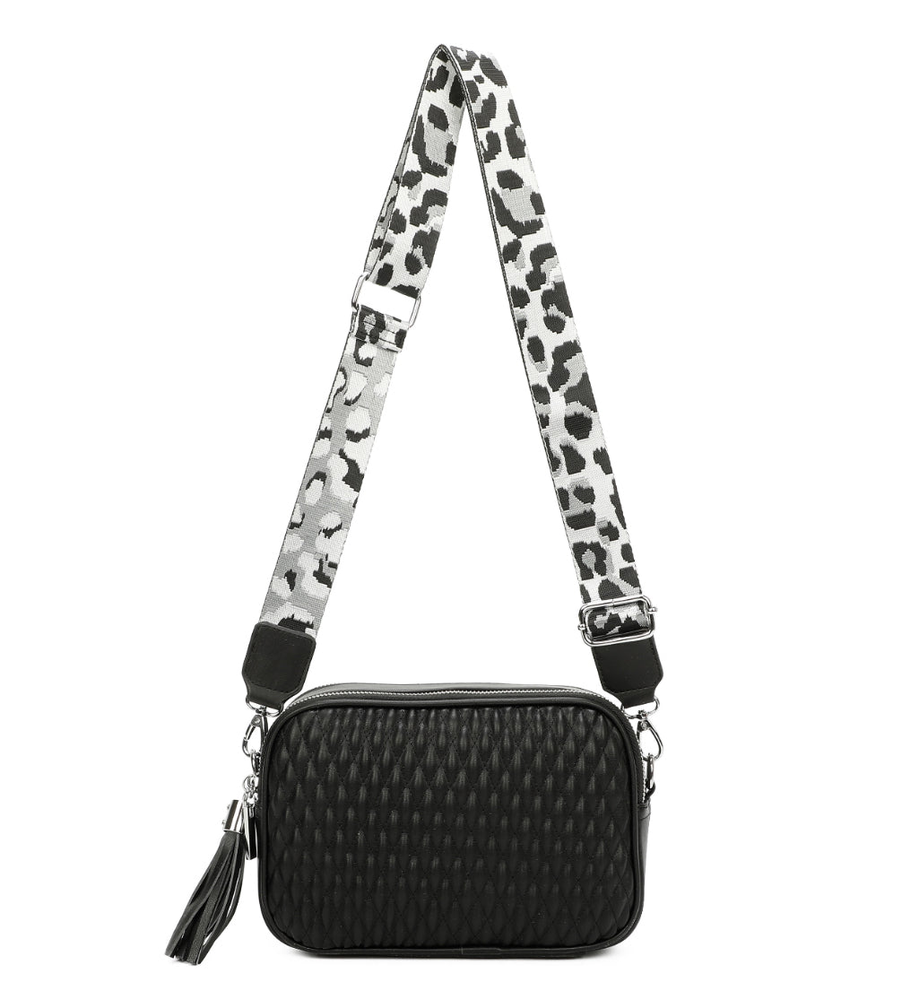 Black textured crossbody bag with a leopard print strap