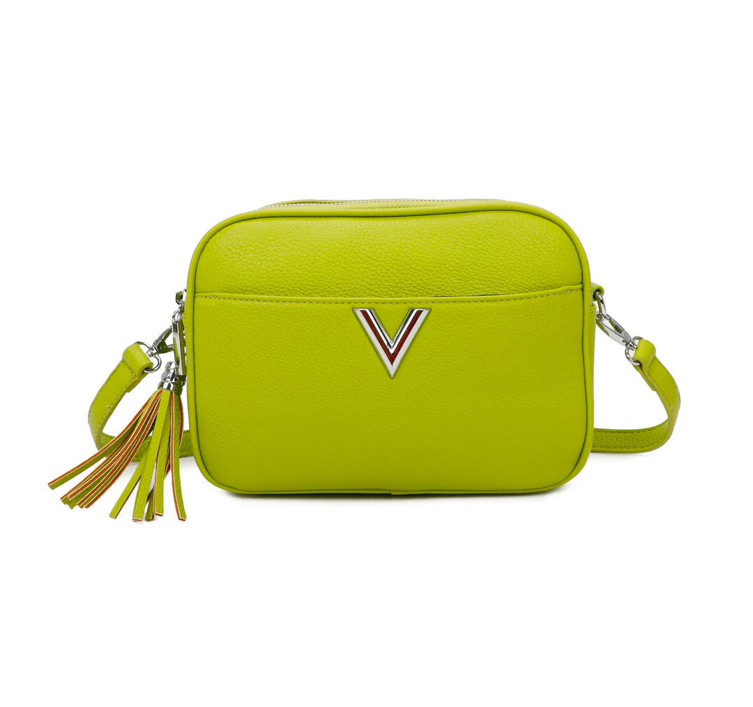 A bright green faux leather crossbody bag with a double zip closure, silver tone metal hardware, and an adjustable long strap. It features a front pocket,