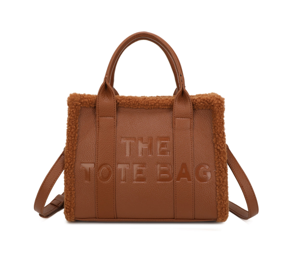 Tote bags with fuzzy edge trim, embossed with ‘The Tote Bag’ on the front in brown