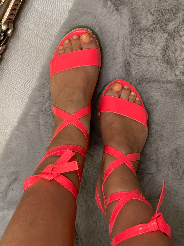 Neon pink wedge sandals