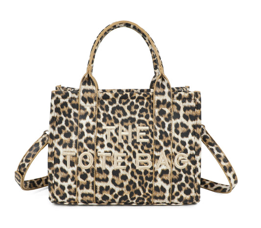 Leopard print tote bag with 'THE TOTE BAG' text with a adjustable detachable long strap