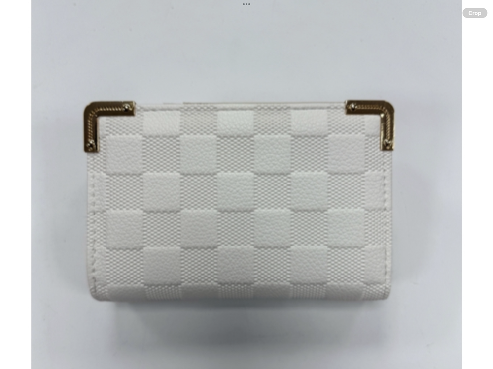 A white quilted checked purse with gold-coloured edges and a zipper closure.