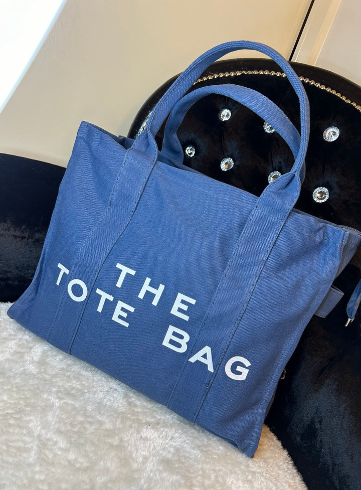 Blue canvas large tote bag with the text &