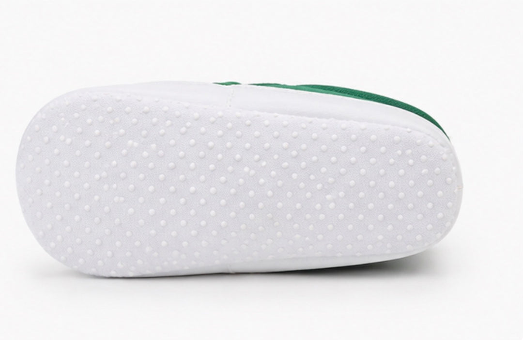 Soft baby crib shoes with striped pattern and flexible non-slip white sole 