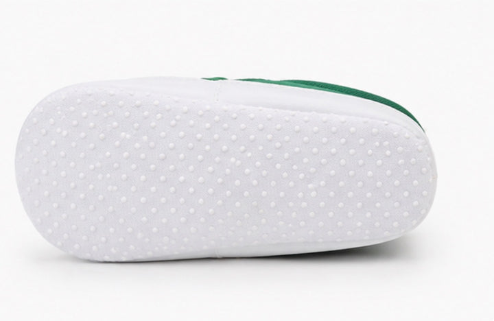 Soft baby crib shoes with striped pattern and flexible non-slip white sole 