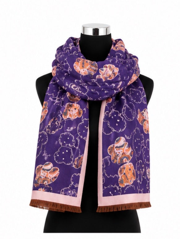 Teddy print oversized fringed scarf available in teal blue with cream trim and purple with pink trim.