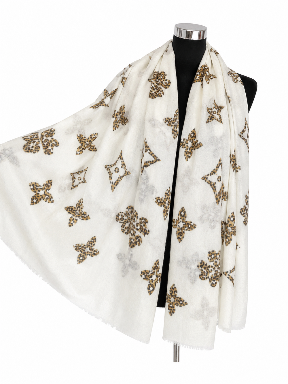 Cream statement scarf with brown and black leopard-print motifs and subtle fringed edging.