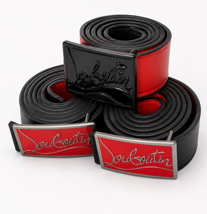  belts with red and black colour scheme one with black buckle