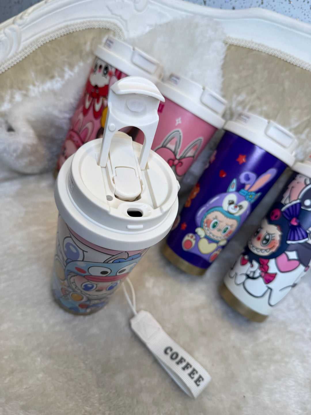 Colorful cartoon-themed tumbler with a straw 