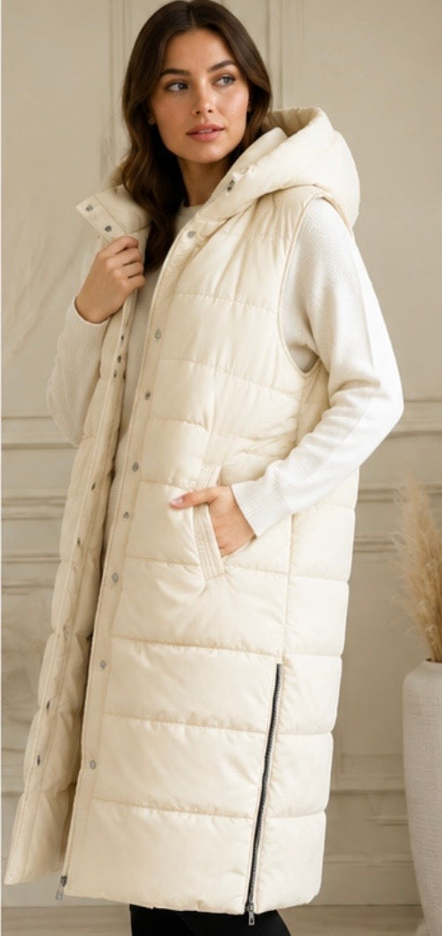 Long cream padded gilet with hood, quilted design and front zip fastening, sleeveless puffer bodywarmer with pockets