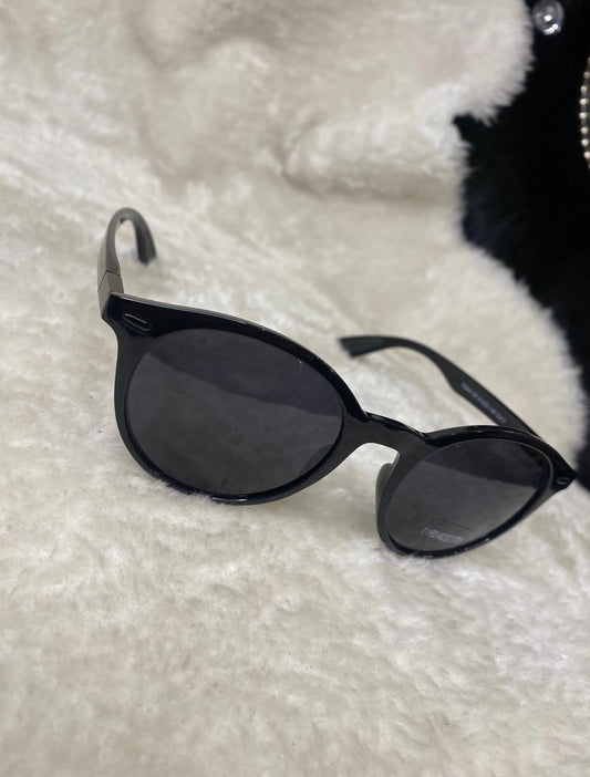A pair of black small unisex sunglasses. 