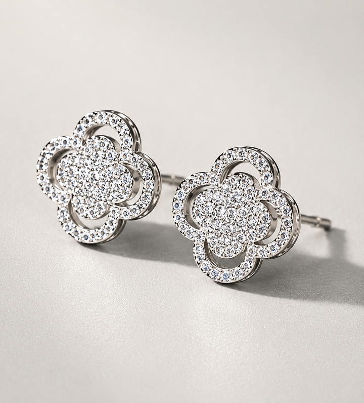 Silver crystal clover stud earrings with sparkling pavé detailing 