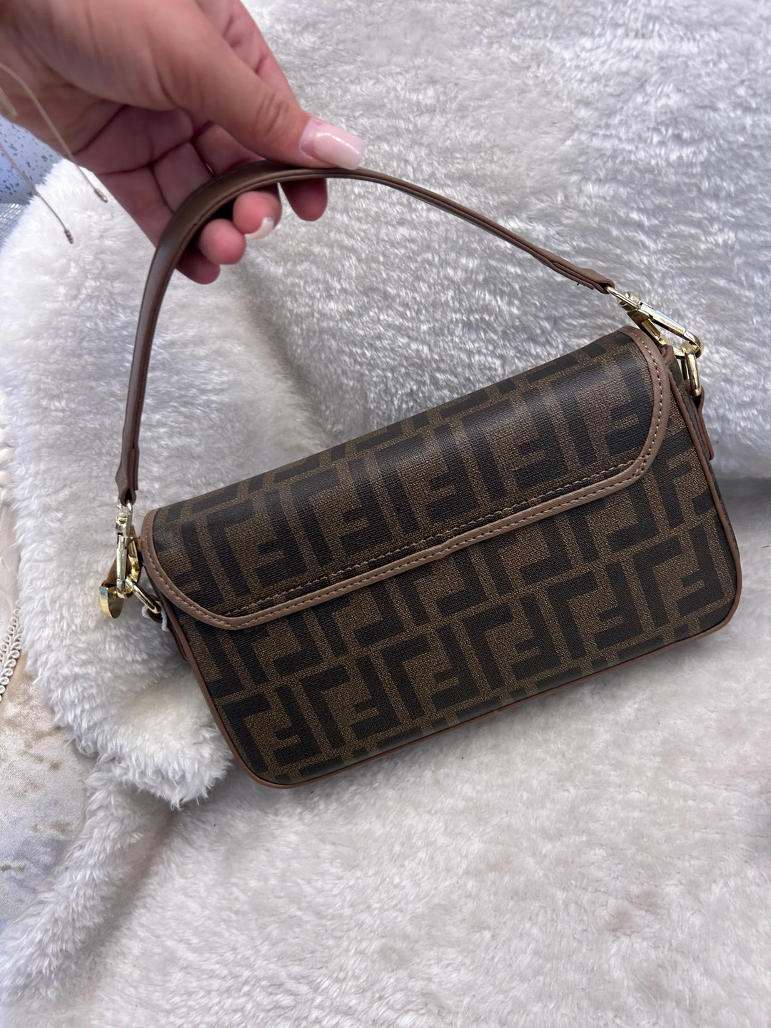 Brown geometric print handbag with shoulder strap 