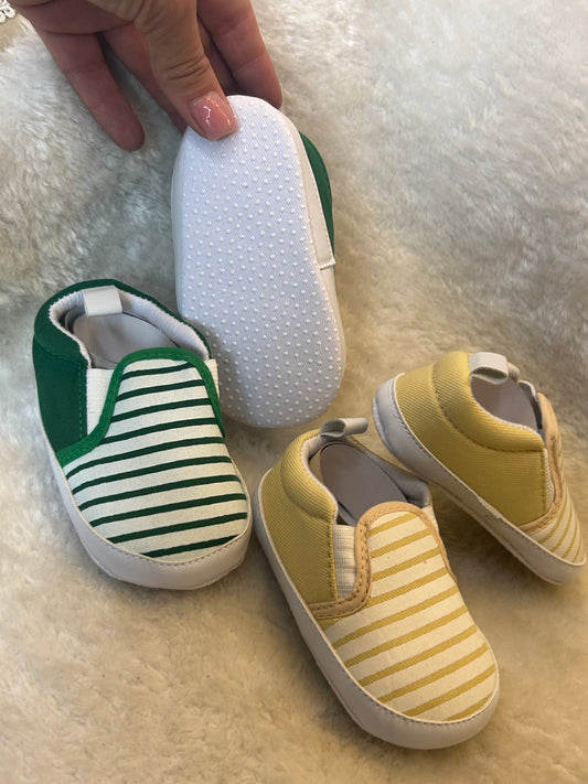 Baby slip-on shoes with striped design, soft white soles with grip dots