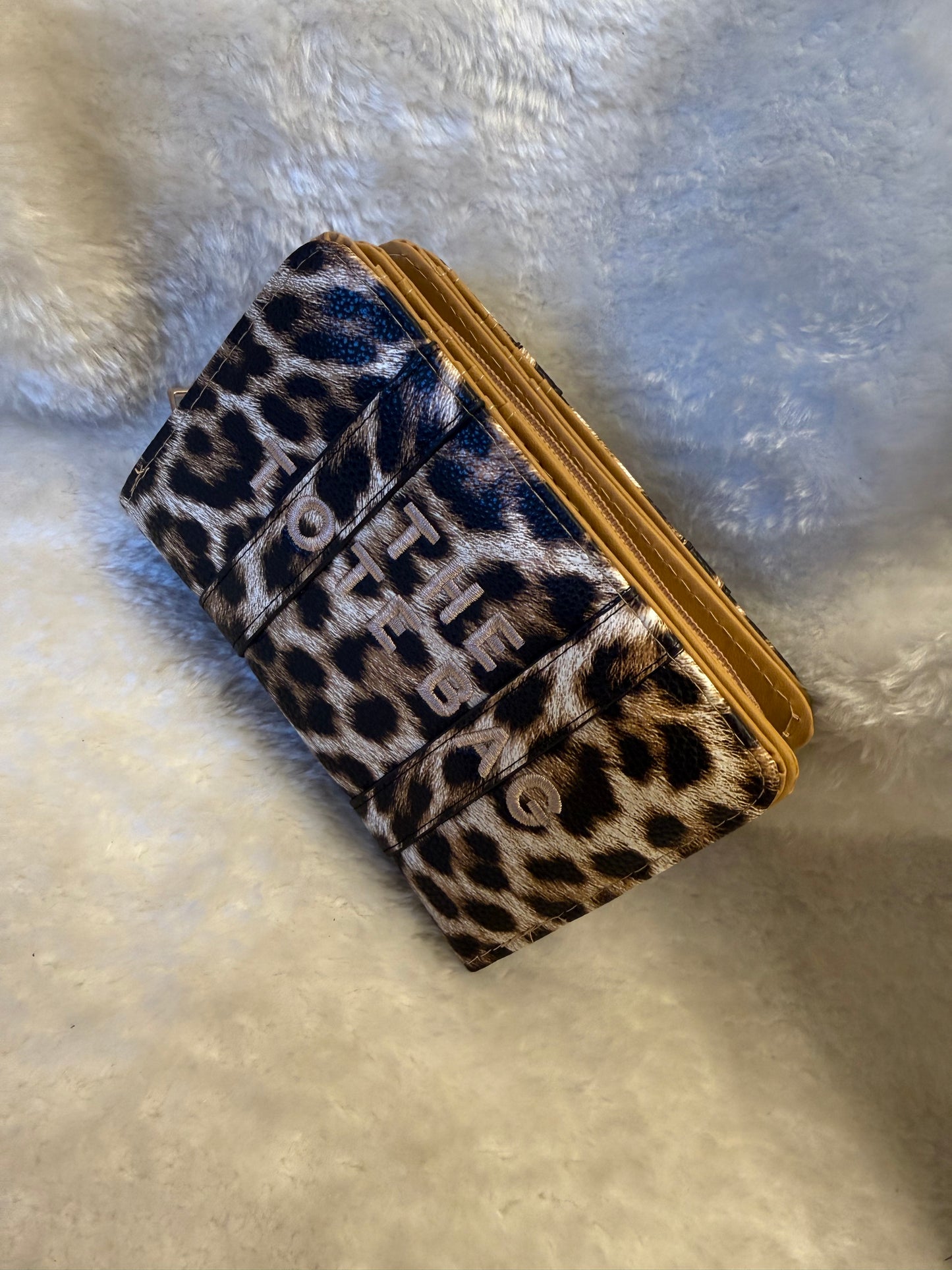 Leopard animal print card holders purses with embossed ‘The Tote Bag’ lettering and gold zip detail