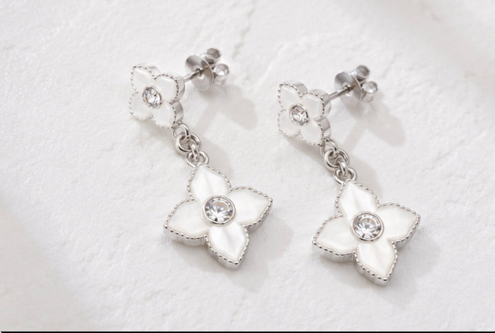 White stainless steel clover drop earrings with crystal centres