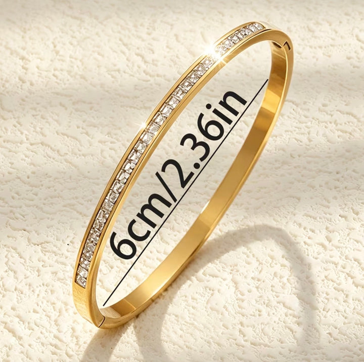 Gold bracelet with silver crystal detail 