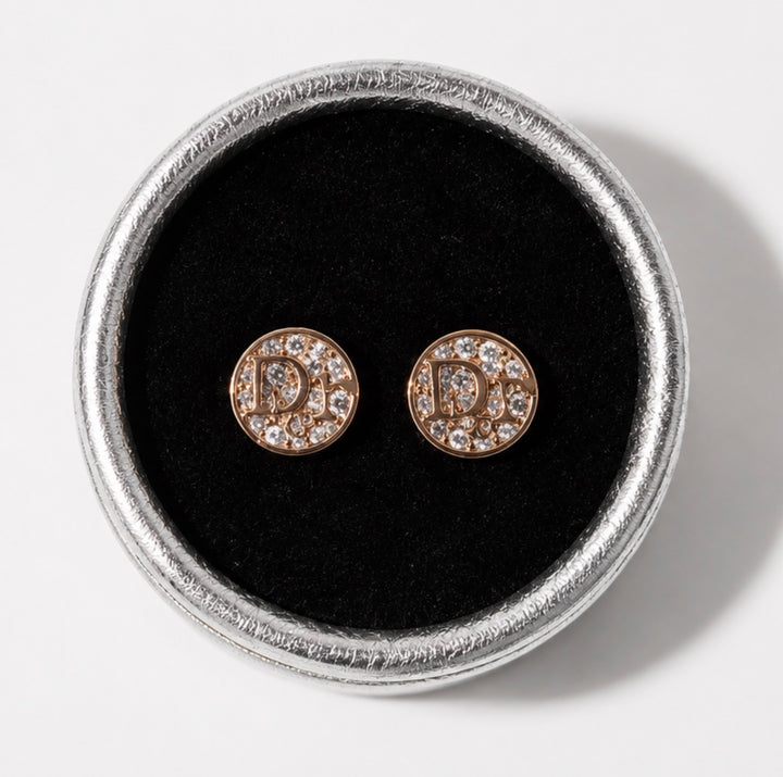 Rose gold crystal letter stud earrings displayed in a silver jewellery box