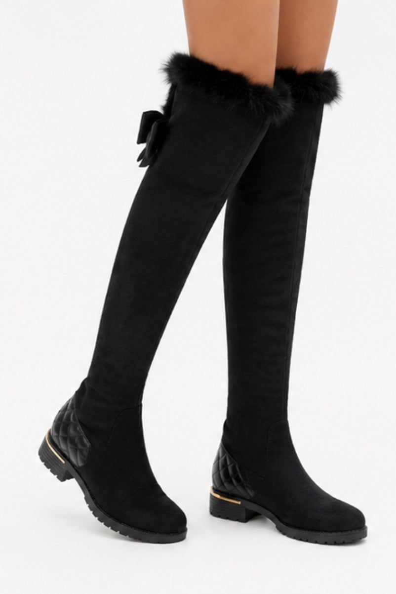 Black over-the-knee boots with faux fur trim and quilted heel detail