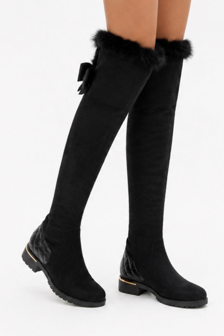 Black over-the-knee boots with faux fur trim and quilted heel detail