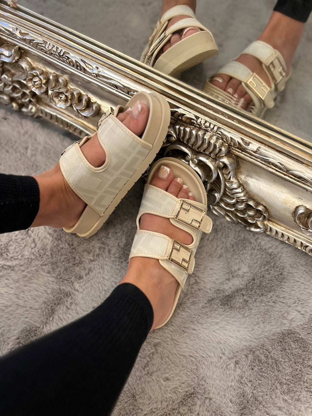 Beige patterned sliders with gold buckle detail