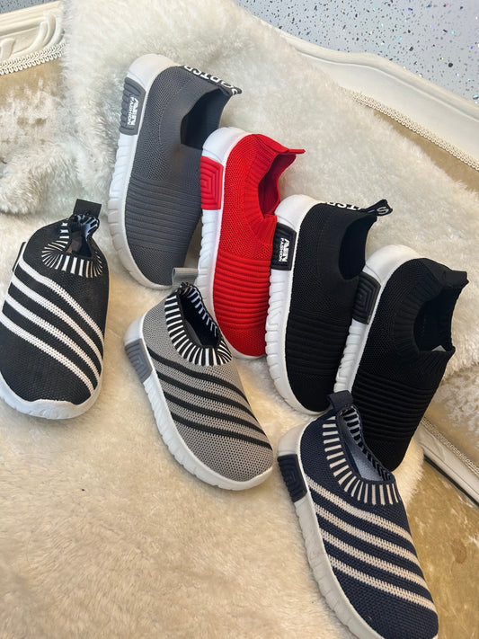 Children’s slip on trainers with white soles 