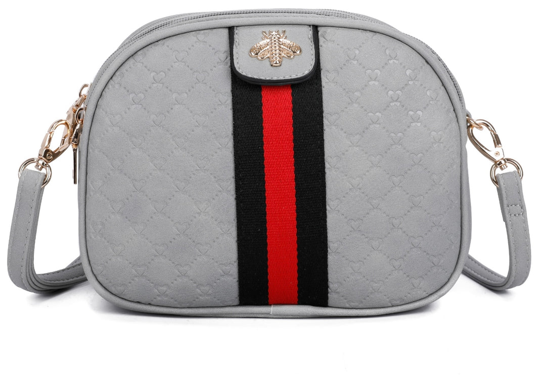 A grey quilted bee design cross body bag with a detachable and adjustable strap, featuring golden tone metal hardware.