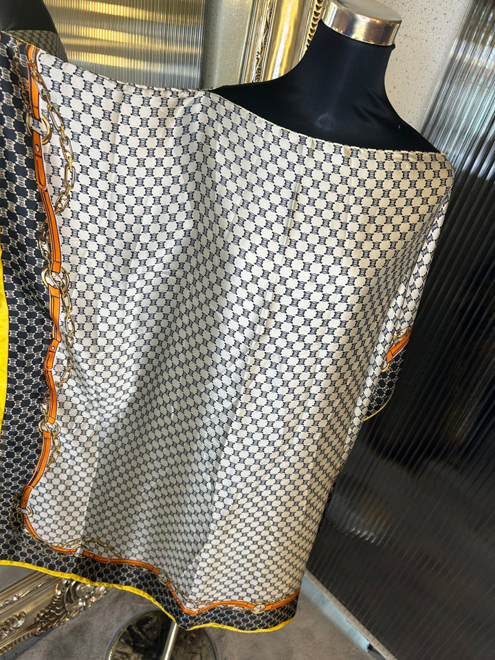 Beige and black inspired print kaftan with orange and yellow strip around the edge 