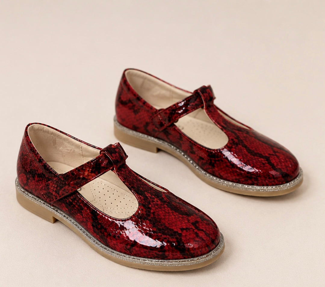 Red snakeskin-effect occasional shoes with glitter sole detail and fastening strap.