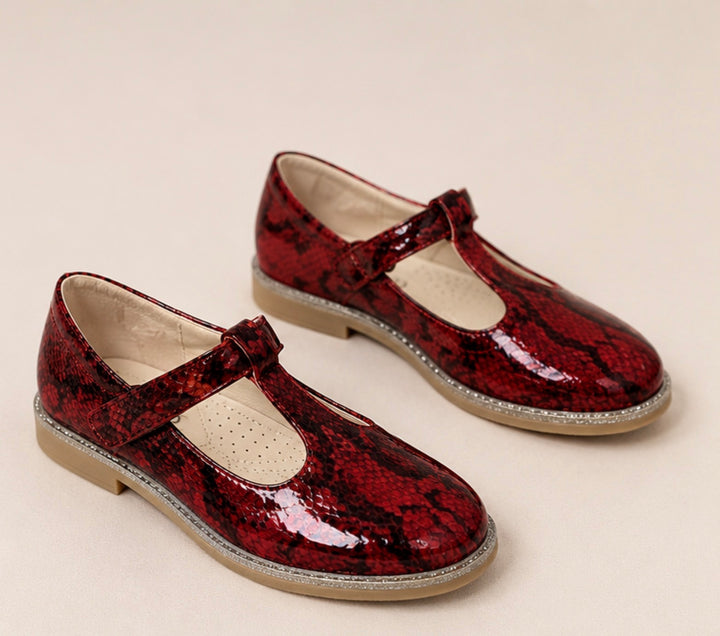 Red snakeskin-effect occasional shoes with glitter sole detail and fastening strap.