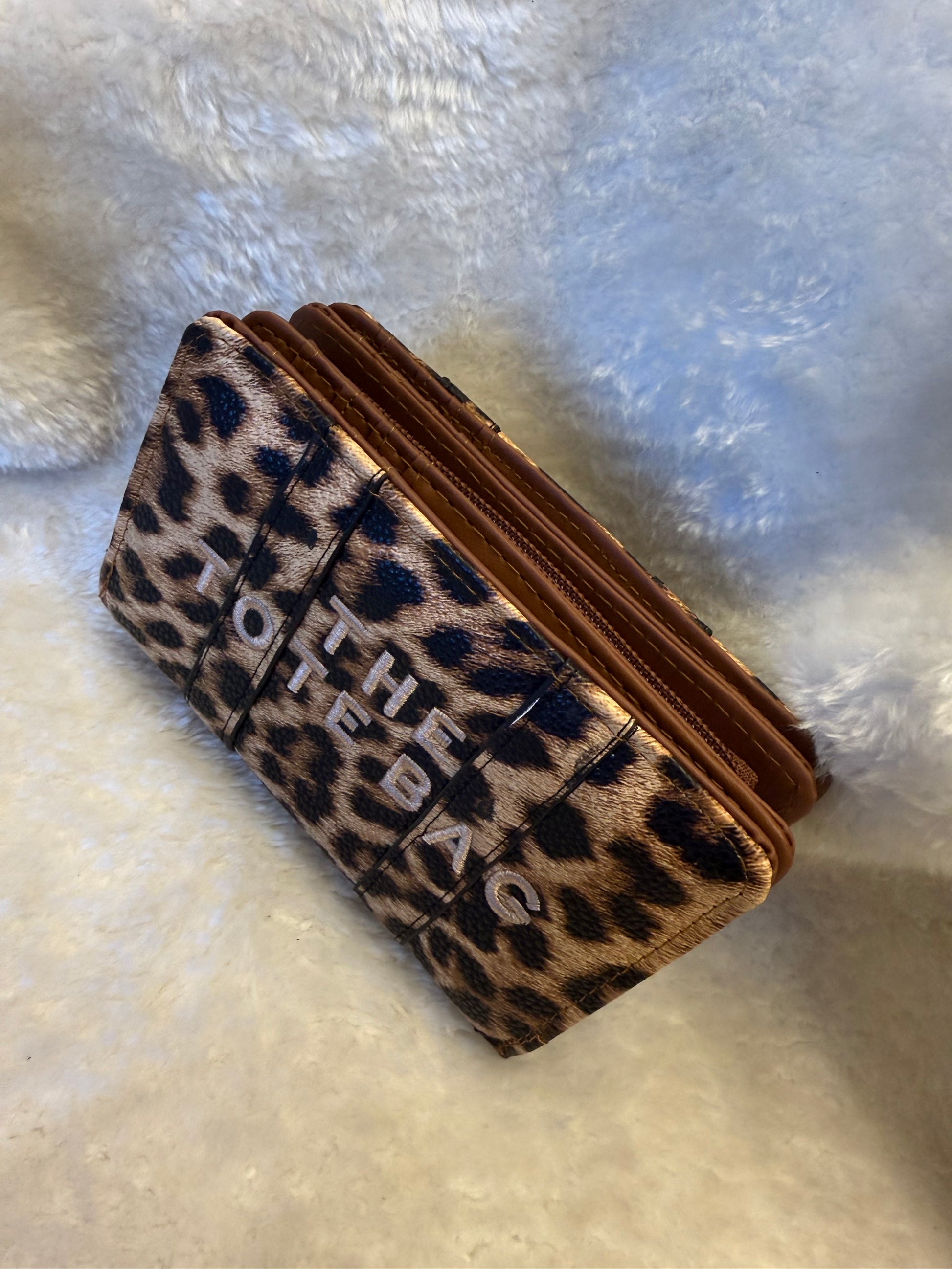 Leopard animal print card holders purses with embossed ‘The Tote Bag’ lettering and gold zip detail