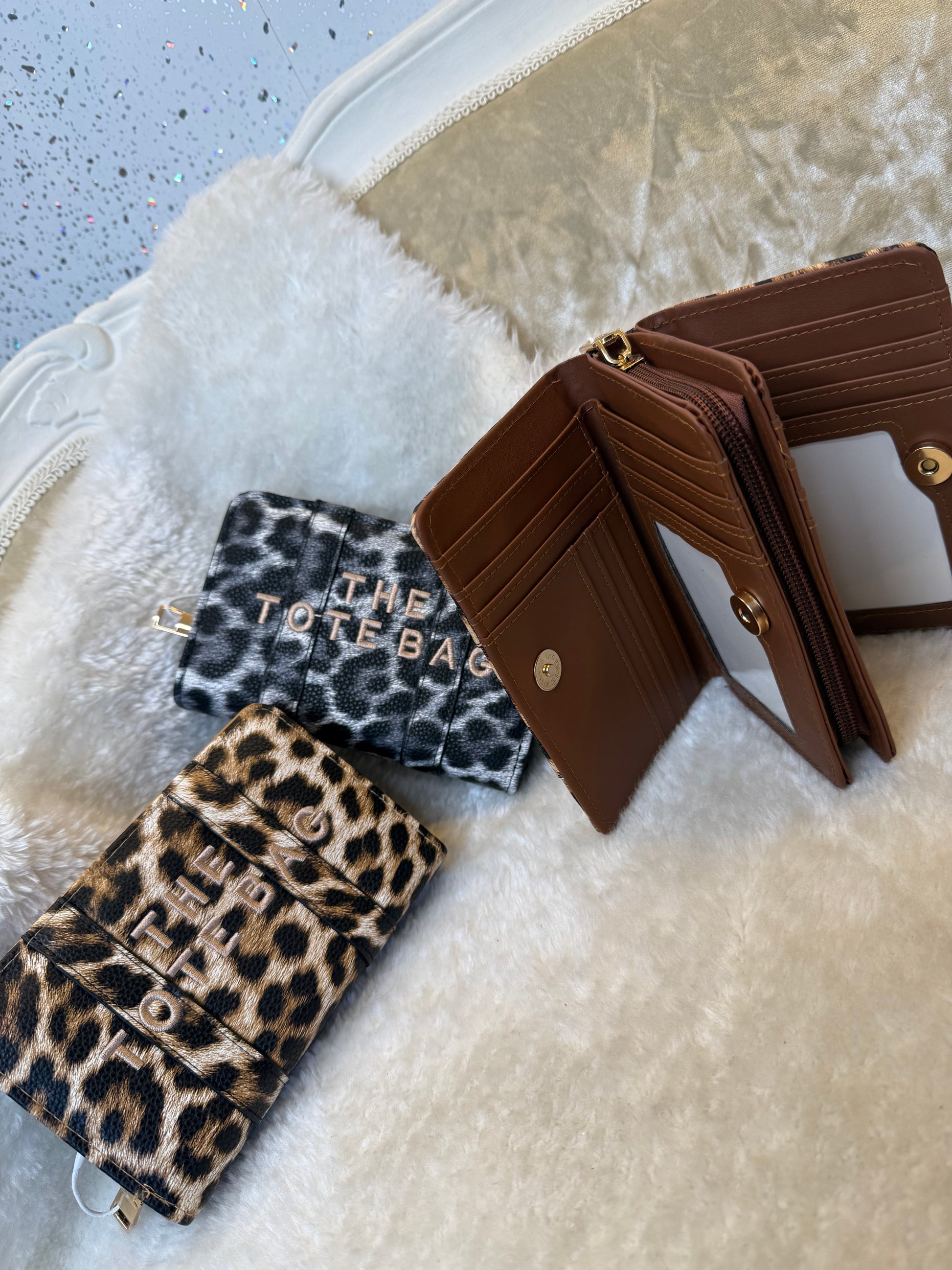 Leopard animal print card holders purses with embossed ‘The Tote Bag’ lettering and gold zip detail
