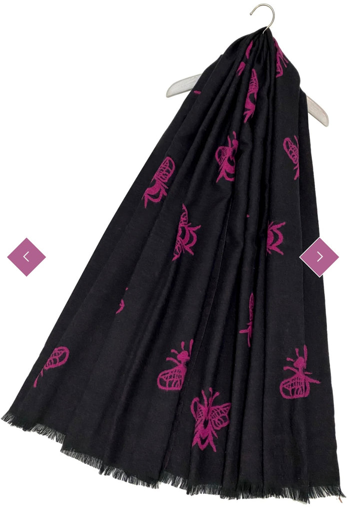 A black scarf with a bee print