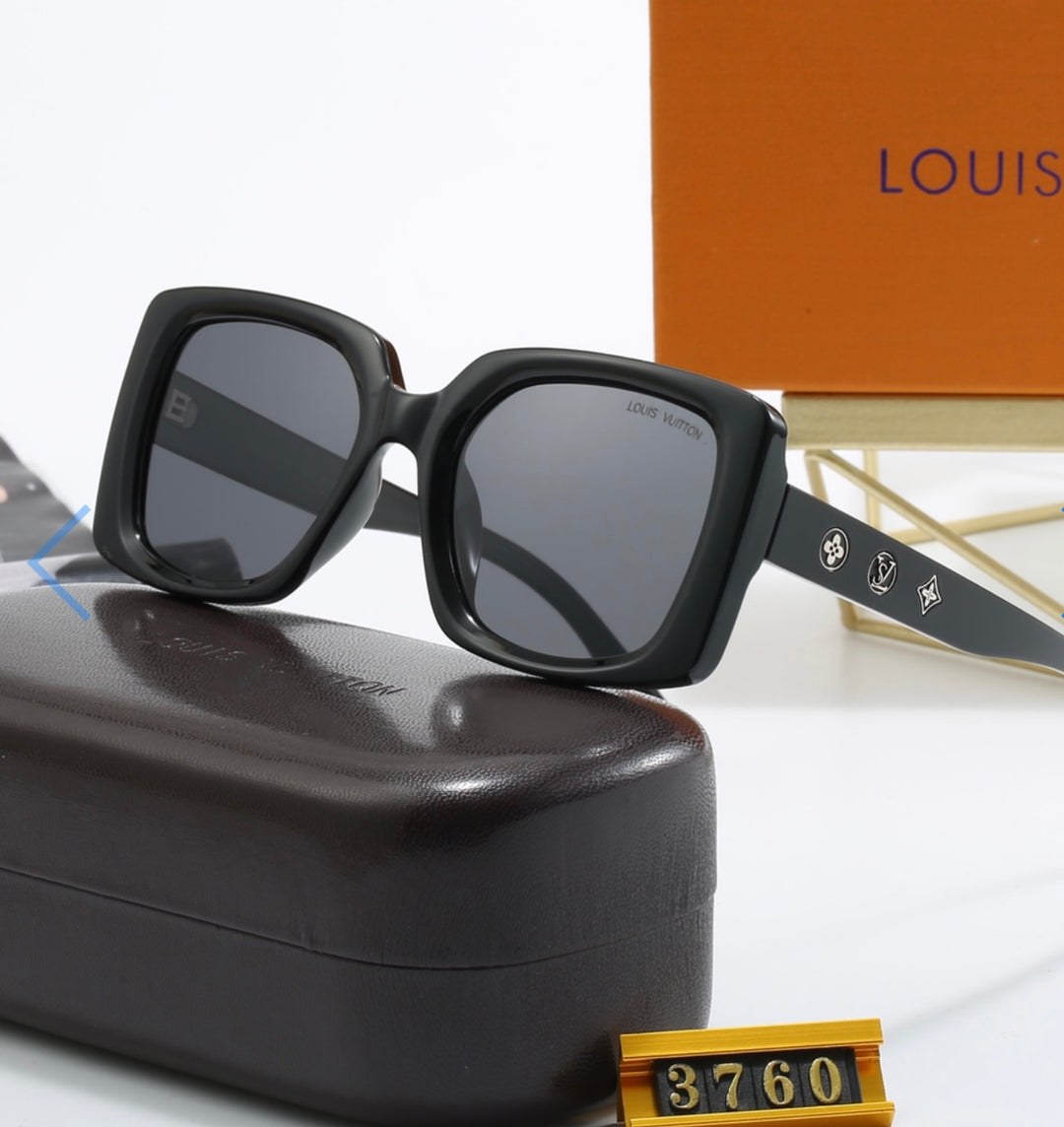 Black sunglasses with gold detailing 