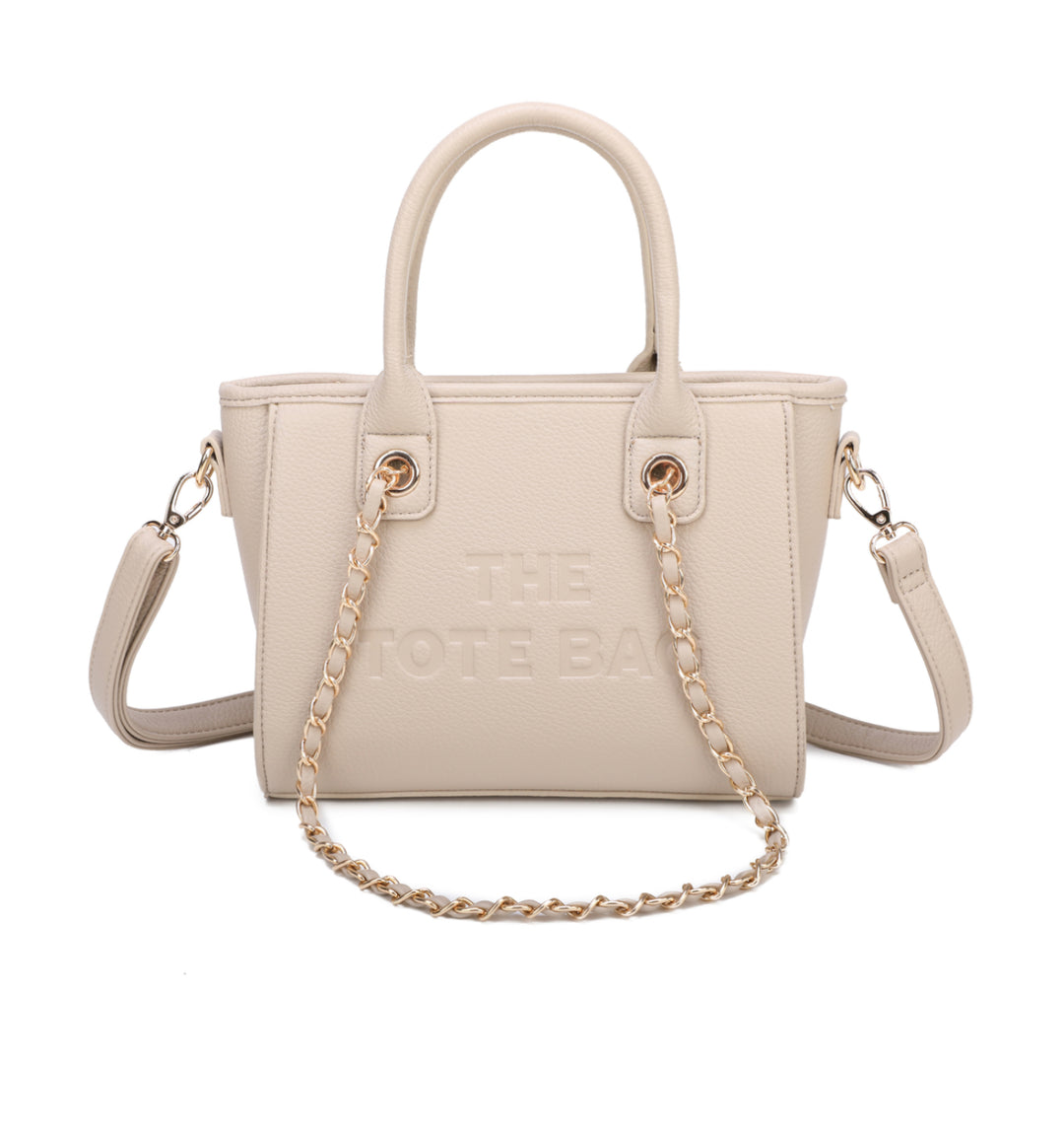 A beige tote bag with a chain handle, featuring a front zipper pocket and gold tone metal hardware. The &