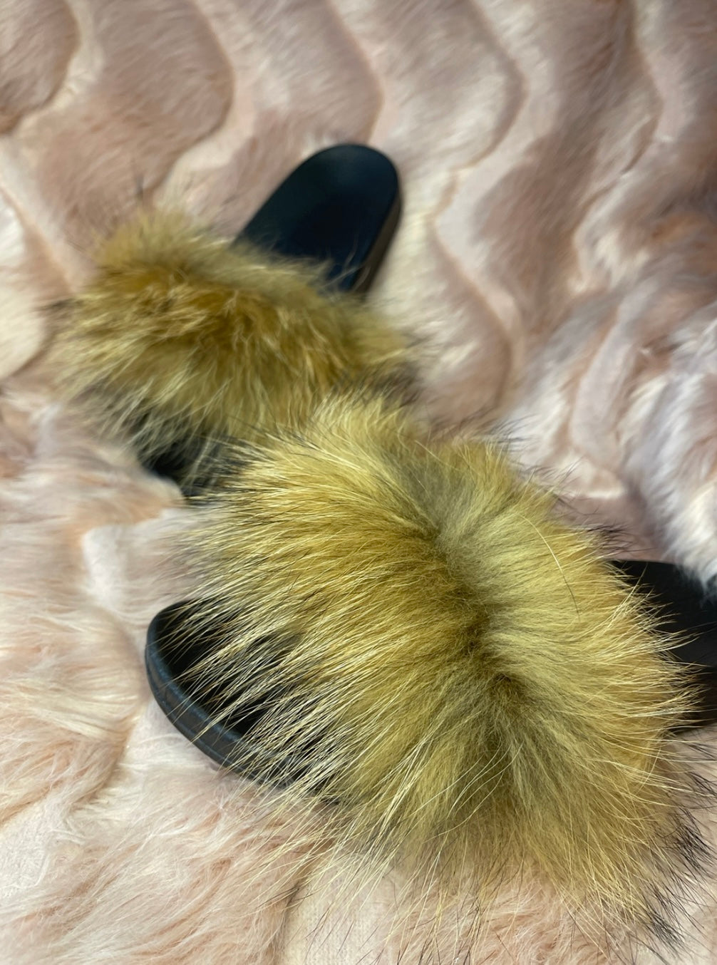 Brown fur sliders with black sole 