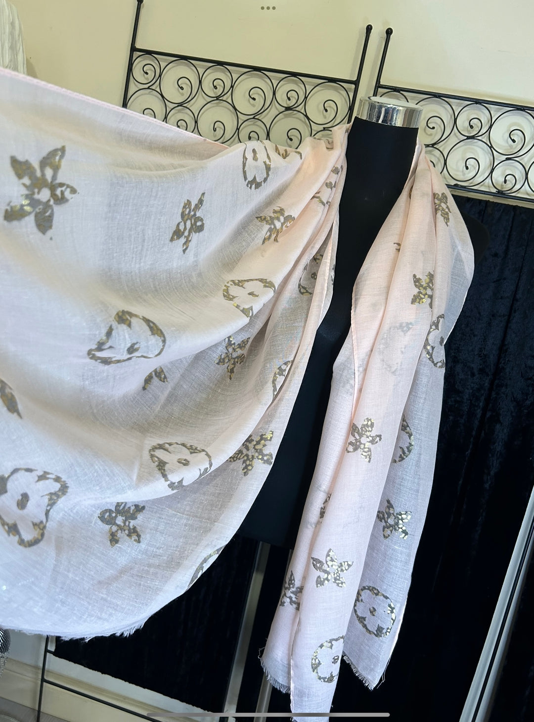 Thin lightweight scarf with flower print design, ideal for spring and summer wear.