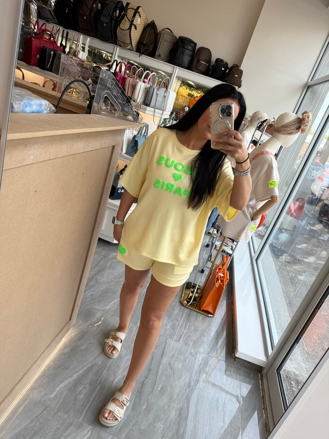 Shorts and T-shirt set in yellow with green writing text 