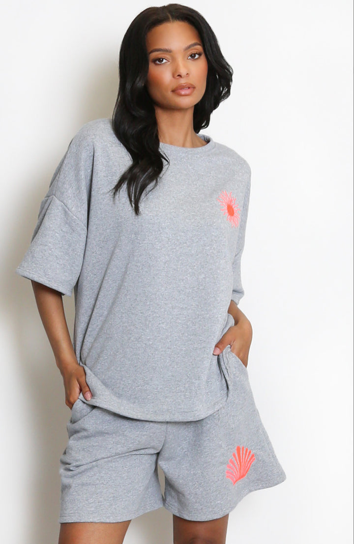  a grey outfit with pink accents 