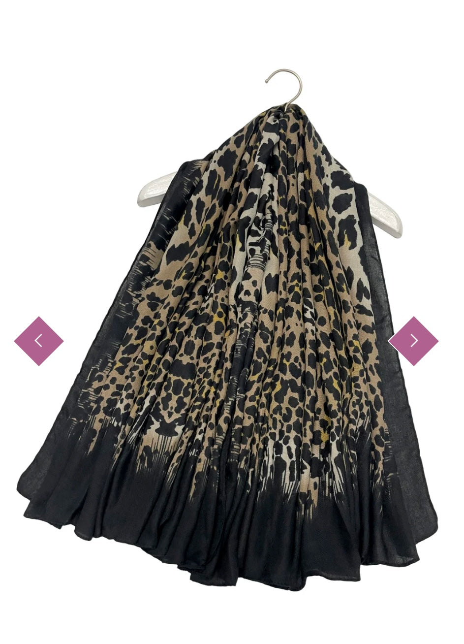 A leopard print thin scarf with a black border