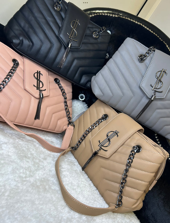 A collection of quilted medium sized handbags with chain detail in black, grey, pink, and beige colours.